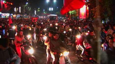 Motorcycles-flying-the-Vietnamese-flag-crowd-a-boulevard-during-a-political-demonstration