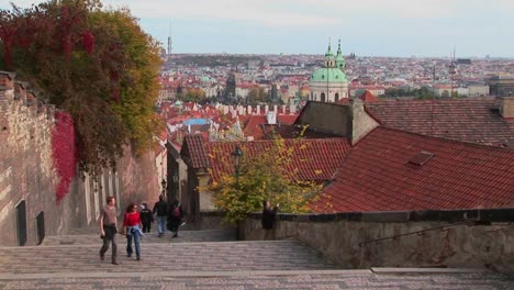 People-walk-on-the-cobblestone-streets-of-Prague-Czech-Republic