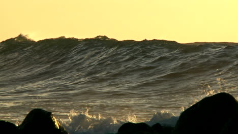 Large-waves-as-they-crest-and-break-in-slow-motion-at-sunset