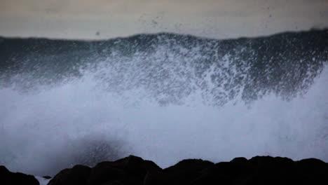 Huge-waves-roll-in-and-crash-against-a-rocky-shoreline-6