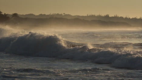 Waves-roll-into-a-beach-following-a-big-storm-in-slow-motion