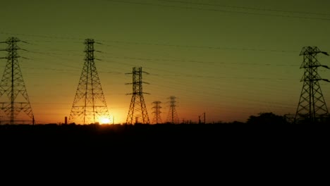 The-sun-sets-behind-high-tension-lines-in-this-time-lapse-shot