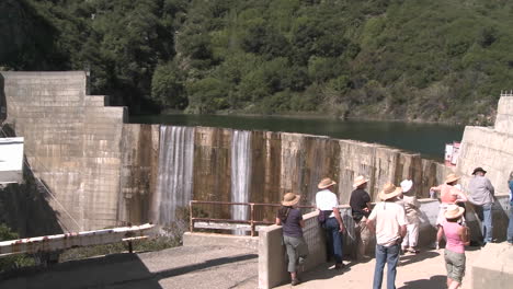 Side-view-of-water-spilling-over-the-Matilija-Dam-during-a-guided-tour-in-Ojai-California