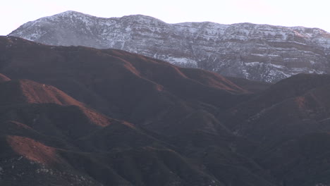 Closeup-pan-of-the-snow-covered-Topa-Topa-Mountain-above-Ojai-California