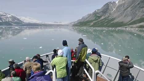 Point-of-view-Time-lapse-of-tourists-sightseeing-from-the-bow-of-a-ship-approaching-Marguerite-Glacier-in-Glacier-Bay-National-Park-Alaska