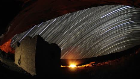 Time-lapse-star-trail-streaks-over-a-Chacoan-rock-house-in-Gallo-Wash-in-Chaco-Culture-National-Historical-Park-New-Mexico