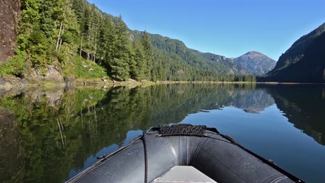 POV-boat-ride-cruising-through-a-glassy-waters-in-Fords-Terror-in-Tracy-ArmFords-Terror-Wilderness-Area-Southeast-Alaska-2