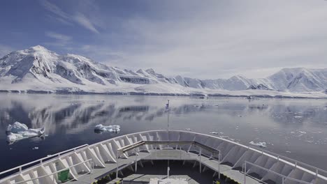 Ship-bow-POV-motion-of-glaciers-and-mountains-reflecting-in-Gerlache-Strait-in-Antarctica