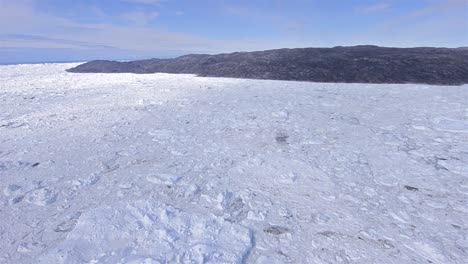 Aerial-of-ice-packed-into-the-terminal-moraine-of-the-Ilulissat-Icefjord-below-Jakobshavn-Glacier-or-Sermeq-Kujalleq