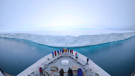 POV-of-a-huge-ship-approaching-to-within-feet-of-a-massive-iceberg-near-Nordaustland-Norway