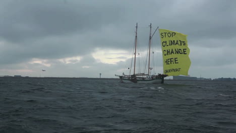 A-ship-with-a-flag-proclaims-an-end-to-global-warming