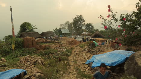 A-child-runs-through-the-crumbled-ruins-of-a-building-following-the-earthquake-in-Nepal-in-April-2015