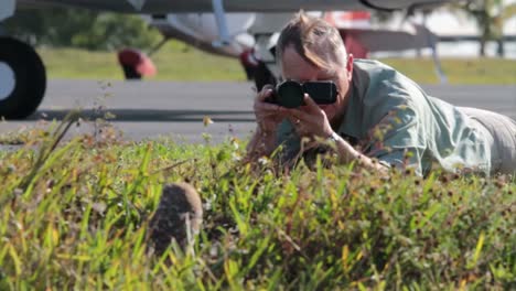 A-nature-photographer-takes-photos-of-a-burrowing-owl-at-its-nest-1