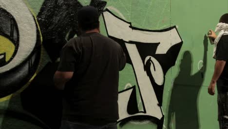 Time-lapse-shot-of-graffiti-being-sprayed-on-a-wall-by-taggers-1