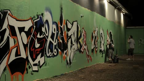 Time-lapse-shot-of-graffiti-being-sprayed-on-a-wall-by-taggers-2