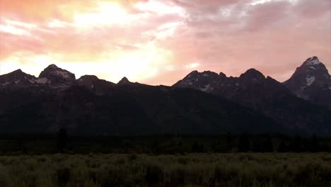 Slow-pan-across-the-Grand-Tetons-mountains-at-dusk-or-sunrise