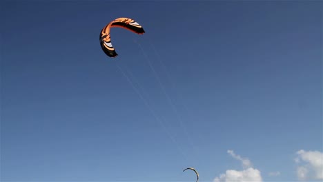 People-engage-in-the-fast-moving-sport-kite-boarding--along-a-sunny-coast-4