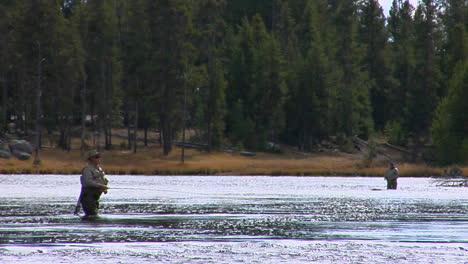 Men-Fly-Fish-In-A-Broad-Shallow-River