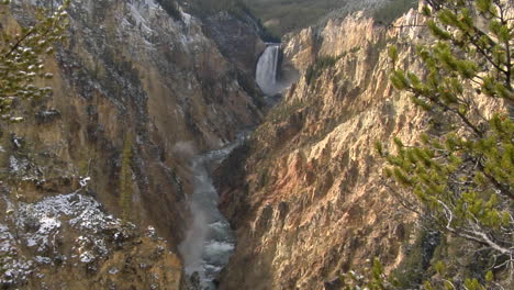 A-Waterfall-Flows-Down-A-Mountainside-In-Yellowstone-National-Park