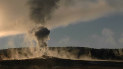 Steam-Billows-Out-Of-Old-Faithful-At-Yellowstone-National-Park