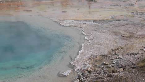 Steam-Rises-From-A-Geothermal-Pool-In-Yellowstone-National-Park-1