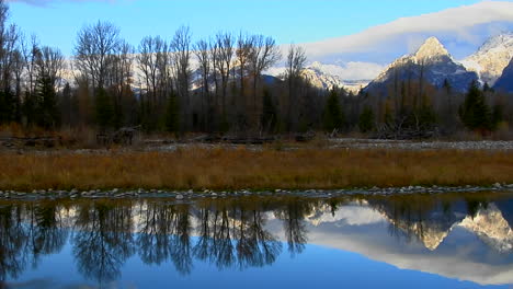 The-Grand-Teton-Mountains-Are-Perfectly-Reflected-In-A-Mountain-Lake-1