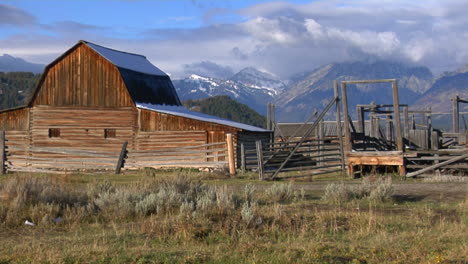 An-Old-Barn-Rises-Out-Of-A-Prairie-With-The-Grand-Tetons-In-The-Background-2