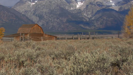 An-Old-Barn-Rises-Out-Of-A-Prairie-With-The-Grand-Tetons-In-The-Background-3