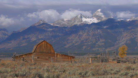 An-Old-Barn-Rises-Out-Of-A-Prairie-With-The-Grand-Tetons-In-The-Background-5