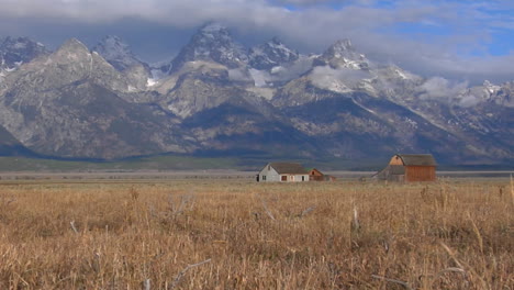 An-Old-Barn-Rises-Out-Of-A-Prairie-With-The-Grand-Tetons-In-The-Background-6