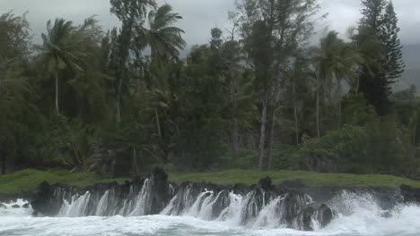A-Large-Pacific-Storm-Batters-A-Tropical-Island-With-Large-Waves