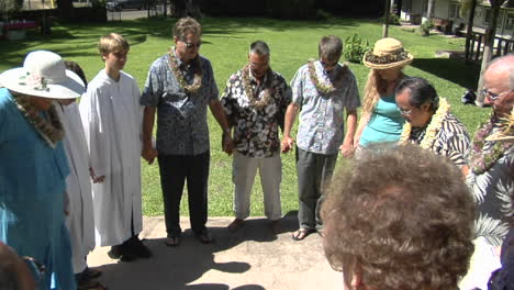 A-Prayer-Circle-Of-Hawaiian-Worshippers-Outside-A-Church