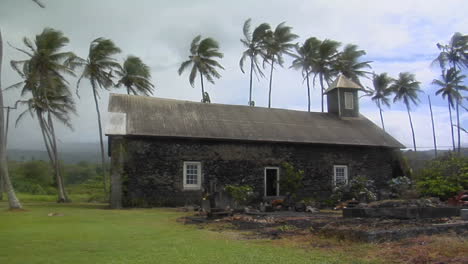 A-Church-Stands-On-A-Tropical-Island-During-A-Wind-Storm-1
