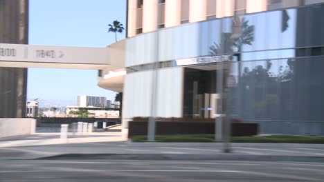 A-Car-Travels-Along-A-Street-In-Century-City-Los-Angeles-As-Seen-Through-The-Side-Window-1