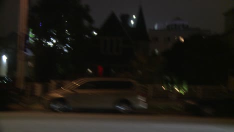 A-Car-Travels-Along-A-Street-At-Night-In-Santa-Monica-California-As-Seen-Through-The-Side-Window-2