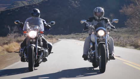 Two-people-ride-motorcycles-out-in-the-country