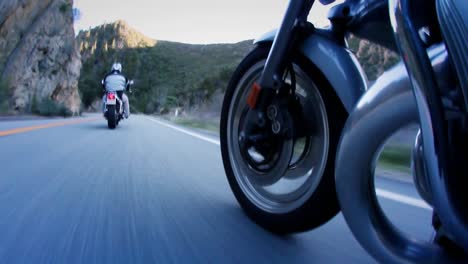 Motorcyclists-are-riding-down-a-mountain-highway