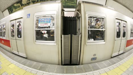 Passengers-enter-and-exit-subway-cars-in-Osaka-Japan