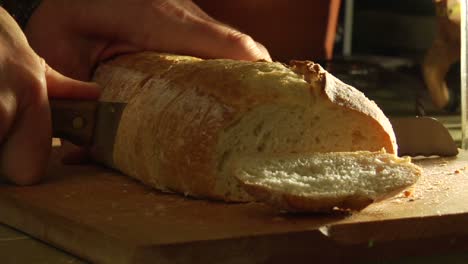 Hands-slice-loaves-of-bread-1