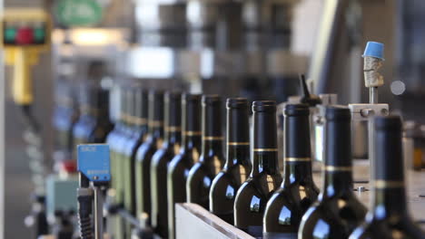 Close-up-shots-of-automation-along-the-assembly-line-inside-a-wine-bottling-factory-3