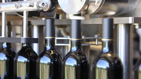 Close-up-shots-of-automation-along-the-assembly-line-inside-a-wine-bottling-factory-7