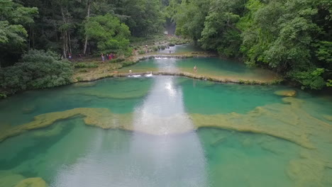 An-aerial-over-remarkable-waterfalls-and-green-polls-on-the-Semuc-Champey-river-in-Guatemala