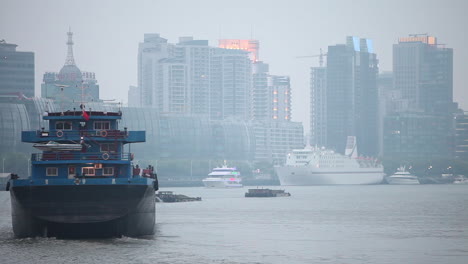 A-barge-travels-on-the-Pearl-River-in-Shanghai-China-in-smog-and-fog-1