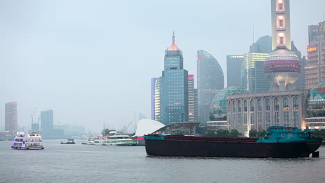 A-barge-travels-on-the-Pearl-River-in-Shanghai-China-in-smog-and-fog-2
