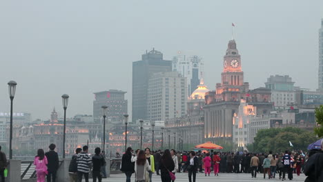 People-walk-on-a-broad-promenade-on-the-waterfront-of-Shanghai-China-1