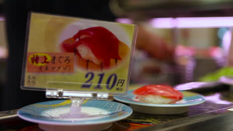 Sushi-items-travel-on-a-conveyor-belt-in-a-restaurant-in-China-1