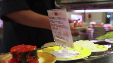 Sushi-items-travel-on-a-conveyor-belt-in-a-restaurant-in-China-2