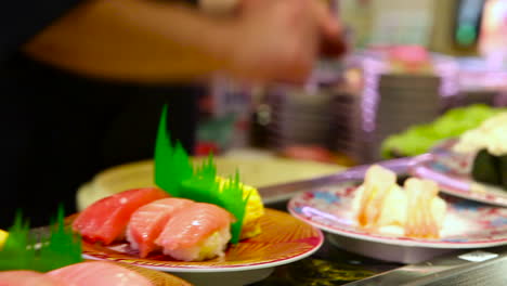 Sushi-items-travel-on-a-conveyor-belt-in-a-restaurant-in-China-3