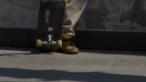 Several-skateboarders-skate-around-and-flip-their-boards