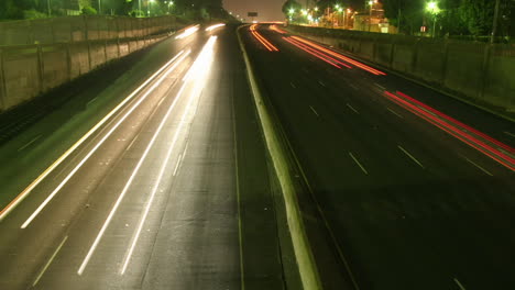 Traffic-drives-along-a-freeway-at-night